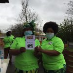 Tosin and Deola holdind up ark of hope leaflets