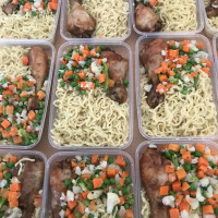 Food cooked in our weekly support of Spotlight Outreach and their support of Manchester's homeless community About 60 plastic of spaghetti. vegetables and chicken about to be given to homeless