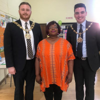 Tosin with the Mayor of Tameside Tosin is Taking a picture with 2 influential men in the community