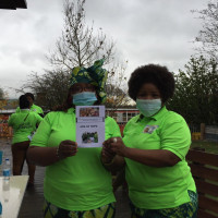 Tosin and Deola raising the pamphlet for the day